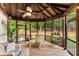 Relaxing screened porch with outdoor seating and views of the landscaped backyard at 725 Danbridge Way, Roswell, GA 30076
