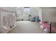 Bright attic space featuring a tent, easel, drum set, and other play items at 820 Wilson Nw Rd, Atlanta, GA 30318