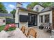 Charming back deck with wooden furniture and a flat screen television, perfect for outdoor relaxation at 820 Wilson Nw Rd, Atlanta, GA 30318