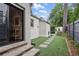 Charming backyard with stone steps, artificial turf and a view of the shed at 820 Wilson Nw Rd, Atlanta, GA 30318