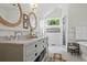 Bright bathroom boasting double sinks, a marble countertop, and modern fixtures at 820 Wilson Nw Rd, Atlanta, GA 30318