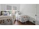 Bright bedroom featuring hardwood floors and two twin beds at 820 Wilson Nw Rd, Atlanta, GA 30318