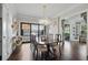 Elegant dining room with hardwood floors, designer lighting and access to the outdoor area at 820 Wilson Nw Rd, Atlanta, GA 30318