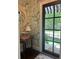 Elegant entryway featuring stylish wallpaper, mirror, and a view to the exterior at 820 Wilson Nw Rd, Atlanta, GA 30318