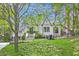 Charming home with a manicured lawn, iron fence and beautiful landscaping at 820 Wilson Nw Rd, Atlanta, GA 30318