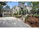 Exterior view showcasing the brick driveway, garage, and charming facade of the home at 820 Wilson Nw Rd, Atlanta, GA 30318