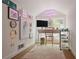 Bright home office featuring a desk, chair, storage cart, and a gallery wall with colorful artwork at 820 Wilson Nw Rd, Atlanta, GA 30318