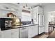 Stylish kitchen featuring stainless appliances, stone countertops, and open shelving at 820 Wilson Nw Rd, Atlanta, GA 30318