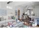 Open concept living room with hardwood floors, designer furniture, and seamless flow to kitchen at 820 Wilson Nw Rd, Atlanta, GA 30318