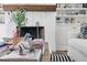 Cozy living room features a stone fireplace, built-in shelving, and stylish decor at 820 Wilson Nw Rd, Atlanta, GA 30318