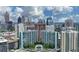 Stunning aerial view of city buildings featuring a central pool and lush green trees at 950 W Peachtree Nw St # 904, Atlanta, GA 30309