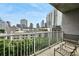 Condo balcony with a great view of the cityscape and outdoor seating at 950 W Peachtree Nw St # 904, Atlanta, GA 30309