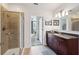 Modern bathroom featuring a glass shower and vanity with granite countertop at 950 W Peachtree Nw St # 904, Atlanta, GA 30309