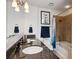 Modern bathroom with granite countertops, double sinks, and a shower-tub combination at 950 W Peachtree Nw St # 904, Atlanta, GA 30309