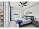 Serene bedroom with a large window, city views, and modern furnishings at 950 W Peachtree Nw St # 904, Atlanta, GA 30309