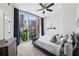 Bright bedroom with a large window, city views, and modern furnishings at 950 W Peachtree Nw St # 904, Atlanta, GA 30309