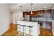 Modern kitchen featuring stainless steel appliances, dark cabinets, and a stylish breakfast bar with seating at 950 W Peachtree Nw St # 904, Atlanta, GA 30309
