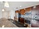 Modern kitchen with dark granite countertops, stainless steel appliances, and ample cabinet space at 950 W Peachtree Nw St # 904, Atlanta, GA 30309