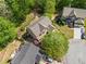 Aerial view of a well-maintained property with lush landscaping, and a cozy backyard at 121 Brendylynn Trce, Woodstock, GA 30188