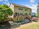 Back of house featuring a deck, patio, and landscaped yard at 121 Brendylynn Trce, Woodstock, GA 30188