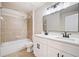 Modern bathroom features double vanity, tub and shower combination with sleek finishes at 121 Brendylynn Trce, Woodstock, GA 30188