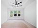 Bedroom with a fan and three windows, which allow for a nice view of the outside at 121 Brendylynn Trce, Woodstock, GA 30188