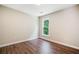 Bedroom with hardwood floors and a window with a view of greenery at 121 Brendylynn Trce, Woodstock, GA 30188