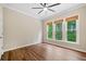 The bedroom boasts large windows offering abundant natural light at 121 Brendylynn Trce, Woodstock, GA 30188