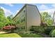 Charming home with multiple windows, beautiful landscaping, and a lush green lawn at 121 Brendylynn Trce, Woodstock, GA 30188