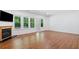 Open living room features hardwood floors, fireplace, and natural light at 121 Brendylynn Trce, Woodstock, GA 30188