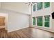 Inviting living room with large windows and hardwood floors, offering abundant natural light at 121 Brendylynn Trce, Woodstock, GA 30188