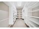 This walk-in closet has custom shelving and storage at 121 Brendylynn Trce, Woodstock, GA 30188