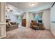 Large bedroom featuring a projector screen, ceiling fan, home office, and sitting area at 2212 Knoxhill Se Vw, Smyrna, GA 30082