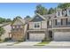 Attractive townhouse with stone veneer, attached garage, and manicured landscaping in a desirable neighborhood at 2212 Knoxhill Se Vw, Smyrna, GA 30082