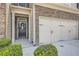 Inviting entryway with stone accents, neutral siding, and an attached two-car garage, creating a welcoming curb appeal at 2212 Knoxhill Se Vw, Smyrna, GA 30082