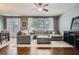 Combined living and dining space boasting hardwood floors, modern decor, and an open, airy atmosphere at 2212 Knoxhill Se Vw, Smyrna, GA 30082