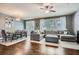 Open-concept living and dining area with hardwood floors, modern furnishings, and plenty of natural light at 2212 Knoxhill Se Vw, Smyrna, GA 30082