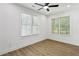 Bright bedroom featuring wood floors, recessed lighting, and two windows with blinds offering ample natural light at 2438 2Nd Nw St, Atlanta, GA 30318