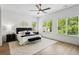 Bedroom with a ceiling fan and large windows at 2438 2Nd Nw St, Atlanta, GA 30318