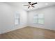 Light-filled bedroom featuring a ceiling fan, recessed lights, and hardwood floors at 2438 2Nd Nw St, Atlanta, GA 30318