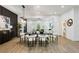 Dining room boasts modern lighting fixture, hardwood floors, view of living room and decor at 2438 2Nd Nw St, Atlanta, GA 30318