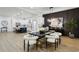 Open-concept dining room features modern light fixture, hardwood floors, and view to kitchen at 2438 2Nd Nw St, Atlanta, GA 30318