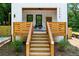 Inviting front porch featuring a ceiling fan, modern railings, a stylish entrance, and steps leading to a welcoming entrance at 2438 2Nd Nw St, Atlanta, GA 30318