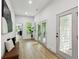 Hallway with hardwood floors, a bench, and natural light at 2438 2Nd Nw St, Atlanta, GA 30318