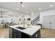 Spacious kitchen with island, pendant lighting and view to dining and living area at 2438 2Nd Nw St, Atlanta, GA 30318