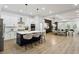 Open concept kitchen with stainless steel appliances, island with seating, and hardwood floors at 2438 2Nd Nw St, Atlanta, GA 30318