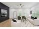 Stylish living room with sleek accent wall, modern fireplace, plush seating, and bright windows at 2438 2Nd Nw St, Atlanta, GA 30318