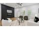 Stylish living room with sleek accent wall, modern fireplace, plush seating, and bright windows at 2438 2Nd Nw St, Atlanta, GA 30318