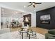 Open-concept living space with modern fireplace, dining area, and access to the bright kitchen featuring stainless steel appliances at 2438 2Nd Nw St, Atlanta, GA 30318
