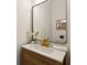 Powder room features wood vanity, marble countertop, and gold faucet at 2438 2Nd Nw St, Atlanta, GA 30318